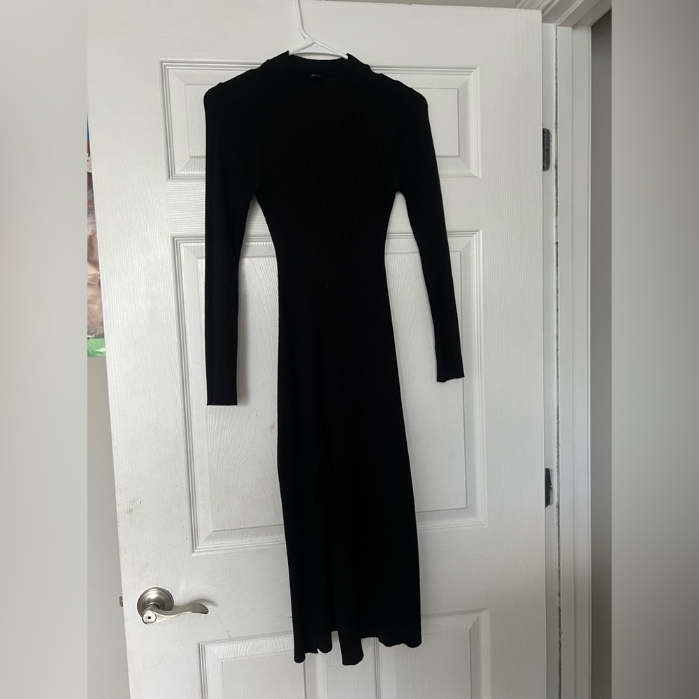 Black bodycon dress with a slit in the front. Very pretty dress, worn 3 times